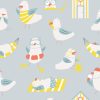seagulls on the beach sunbathing and beach huts